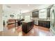 A well-equipped kitchen island with modern appliances flows into an open-concept living space at 7650 W Berkeley Rd, Denver, NC 28037