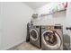 Laundry room with a washer, dryer and shelving at 7650 W Berkeley Rd, Denver, NC 28037