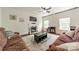 This living room has a fireplace and large rug between the two sofas at 7650 W Berkeley Rd, Denver, NC 28037