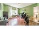 Spacious home office with natural light boasts hardwood floors, providing an ideal workspace at 7650 W Berkeley Rd, Denver, NC 28037