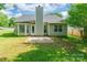 Backyard featuring a lush lawn, patio area, and exterior of the home at 8339 Hornwood Ct, Charlotte, NC 28215