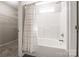 Clean bathroom with modern tub/shower combo and a walk-in closet at 8339 Hornwood Ct, Charlotte, NC 28215