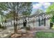 Charming home featuring attached garage, neutral siding, and manicured landscaping at 8339 Hornwood Ct, Charlotte, NC 28215