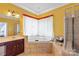 Bright bathroom with large soaking tub and tiled walk-in shower at 8914 Landsdowne Ave, Harrisburg, NC 28075