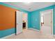 Bright bedroom with turquoise walls, access to a bathroom and another bedroom at 8914 Landsdowne Ave, Harrisburg, NC 28075