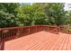 Spacious outdoor deck with red railing perfect for entertaining at 8914 Landsdowne Ave, Harrisburg, NC 28075
