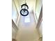 Grand foyer featuring a striking chandelier and soaring ceilings, enhanced by a transom window at 8914 Landsdowne Ave, Harrisburg, NC 28075