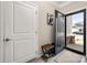 Inviting foyer features a stylish front door, coat closet, and charming decor at 9034 Evercrisp Ln, Charlotte, NC 28215