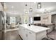 Open concept kitchen features a large island and flows into the dining and living areas at 9034 Evercrisp Ln, Charlotte, NC 28215