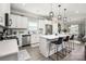 Bright kitchen with white cabinetry, stainless steel appliances, and a quartz-topped island at 9034 Evercrisp Ln, Charlotte, NC 28215