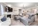 Comfortable living room with a fireplace, large sectional sofa, and contemporary decor at 9034 Evercrisp Ln, Charlotte, NC 28215