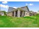 Beautiful backyard with a screened-in porch and well-maintained lawn at 9109 Liberty Hill Dr, Mint Hill, NC 28227