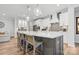 Elegant kitchen with a large island, pendant lighting, stainless steel appliances, and white cabinetry at 9109 Liberty Hill Dr, Mint Hill, NC 28227