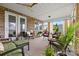 Relaxing screened porch with comfortable seating and plenty of plants at 9109 Liberty Hill Dr, Mint Hill, NC 28227