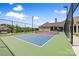 Community tennis court surrounded by lush greenery and blue skies at 9109 Liberty Hill Dr, Mint Hill, NC 28227