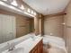 Bathroom featuring double sinks, a large mirror, shower-tub combo and ample vanity storage at 1000 Sarandon Dr, Matthews, NC 28104