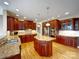 Gourmet kitchen featuring custom cabinetry, granite countertops, stainless steel appliances, and center island at 1000 Sarandon Dr, Matthews, NC 28104