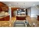 Gourmet kitchen featuring custom cabinetry, granite countertops, stainless steel appliances, and center island at 1000 Sarandon Dr, Matthews, NC 28104