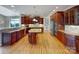 Gourmet kitchen featuring custom cabinetry, granite countertops, stainless steel appliances, and center island at 1000 Sarandon Dr, Matthews, NC 28104