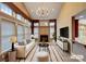 Inviting living room with vaulted ceilings, large windows, fireplace, and modern decor at 1000 Sarandon Dr, Matthews, NC 28104