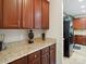 Kitchen with granite countertops, dark wood cabinets, and stainless steel appliances at 1051 Streamlet Way, Monroe, NC 28110