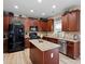 Modern kitchen with stainless steel appliances, a center island, and stylish cabinetry at 1051 Streamlet Way, Monroe, NC 28110