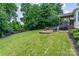 Lush backyard features a large patio area perfect for outdoor dining and entertaining at 1147 Anduin Falls Dr, Charlotte, NC 28269