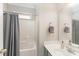 Clean bathroom featuring a shower and tub combination, neutral walls, and vanity at 1147 Anduin Falls Dr, Charlotte, NC 28269