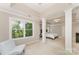Bedroom with a seating area, view of the Primary suite and a window overlooking lush greenery at 1147 Anduin Falls Dr, Charlotte, NC 28269