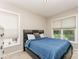 Comfortable bedroom featuring neutral walls, plush carpeting, and lots of natural light at 1147 Anduin Falls Dr, Charlotte, NC 28269
