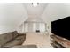 Spacious bonus room with a large TV, comfortable seating, and great natural light at 1147 Anduin Falls Dr, Charlotte, NC 28269