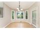 Bright breakfast nook with large windows offering scenic views and an exterior door for easy access at 1147 Anduin Falls Dr, Charlotte, NC 28269