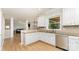 Bright kitchen featuring white cabinets, stainless steel appliances, and granite countertops at 1147 Anduin Falls Dr, Charlotte, NC 28269