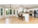 Eat-in kitchen featuring modern appliances, an open layout, and lots of natural light at 1147 Anduin Falls Dr, Charlotte, NC 28269