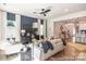Cozy living room features modern ceiling fan, fireplace and large windows at 11619 Sapsucker Ln # 65, Charlotte, NC 28215