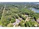 Overhead shot of an upscale neighborhood with private swimming pools nestled among lush greenery and mature trees at 117 Lake Hills Dr, Mooresville, NC 28117