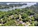 High angle image of homes near a lake, surrounded by mature trees offering a serene and picturesque setting at 117 Lake Hills Dr, Mooresville, NC 28117