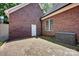Exterior showing brick wall and paver patio area with door and small window at 117 Lake Hills Dr, Mooresville, NC 28117