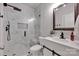 Modern bathroom featuring a walk-in shower with marble tile, and a stylish vanity at 117 Lake Hills Dr, Mooresville, NC 28117