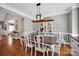 Elegant dining room with hardwood floors, stylish furniture, and decorative lighting at 117 Lake Hills Dr, Mooresville, NC 28117