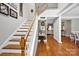 Inviting foyer with hardwood floors, staircase, and stylish decor at 117 Lake Hills Dr, Mooresville, NC 28117