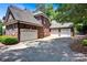 Spacious three-car garage with ample parking space and brick exterior at 117 Lake Hills Dr, Mooresville, NC 28117