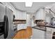 Kitchen featuring stainless steel appliances, granite countertops, and white cabinets for a clean look at 117 Lake Hills Dr, Mooresville, NC 28117