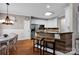 Bright kitchen features stainless steel appliances, breakfast bar with seating, and modern white cabinets at 117 Lake Hills Dr, Mooresville, NC 28117