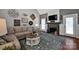 Comfortable living room with fireplace, stylish decor, and hardwood floors at 117 Lake Hills Dr, Mooresville, NC 28117