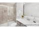 Modern bathroom with tiled shower, sleek vanity, and elegant fixtures, offering a spa-like experience at 11716 Avocet St # 75, Charlotte, NC 28215