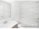 Bright, clean bathroom featuring a shower-tub combo, sleek vanity, and neutral finishes at 11716 Avocet St # 75, Charlotte, NC 28215