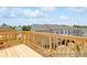 Large wooden deck overlooking the neighborhood and surrounding lush landscape at 11716 Avocet St # 75, Charlotte, NC 28215