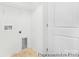 Functional laundry room with a utility sink, storage shelf, and ample space for appliances at 11716 Avocet St # 75, Charlotte, NC 28215