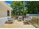 Relaxing deck area with wicker rocking chairs with nautical decor, perfect for enjoying serene outdoor moments at 1215 Cardinal Dr # 9, Gastonia, NC 28052
